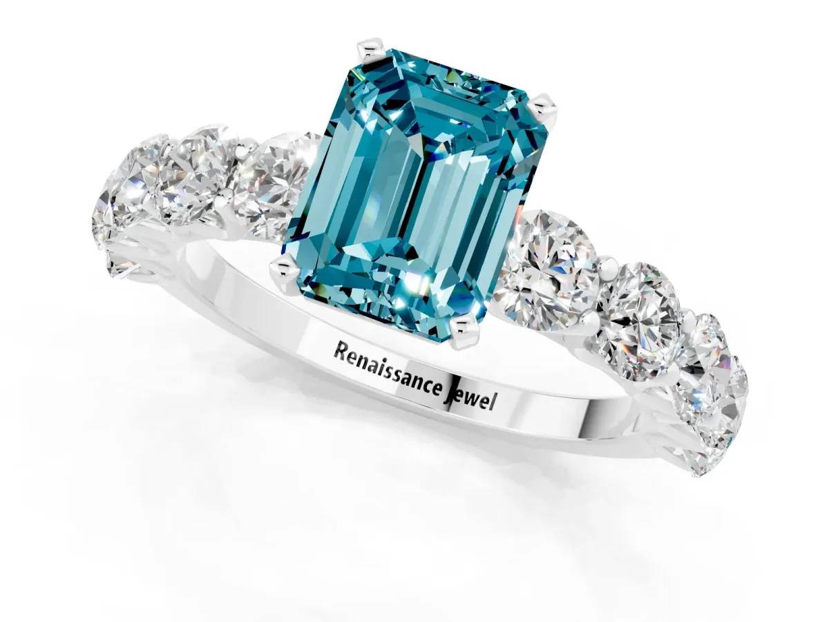 Emerald Cut Blue Topaz Prong Setting with Side Stones on a Pave Band Silver