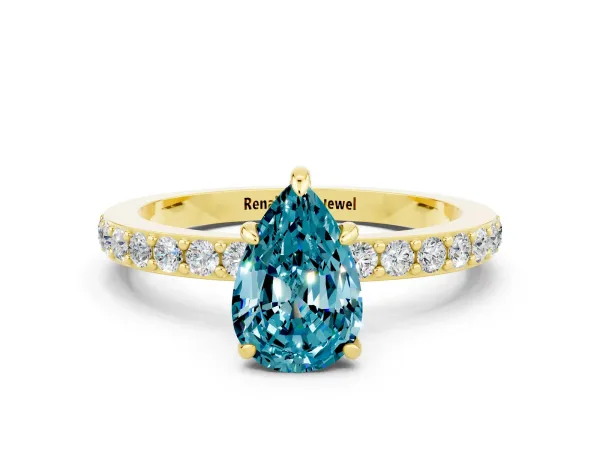 Pear Cut Blue Topaz Solitaire Engagement Ring with Pavé Band and Four-Prong Setting Yellow gold