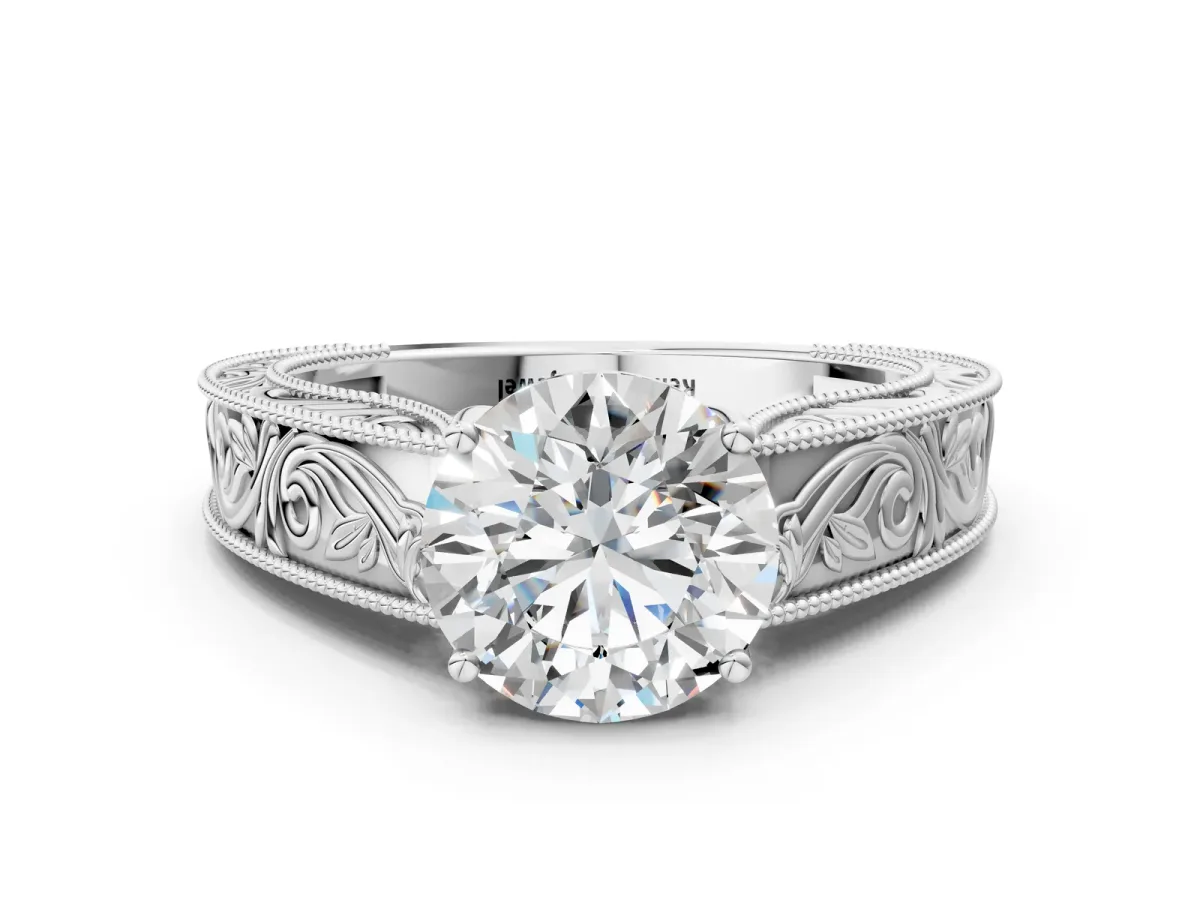 Round Cut Diamond Solitaire Ring with Engraved Band and Four-Prong Setting White gold