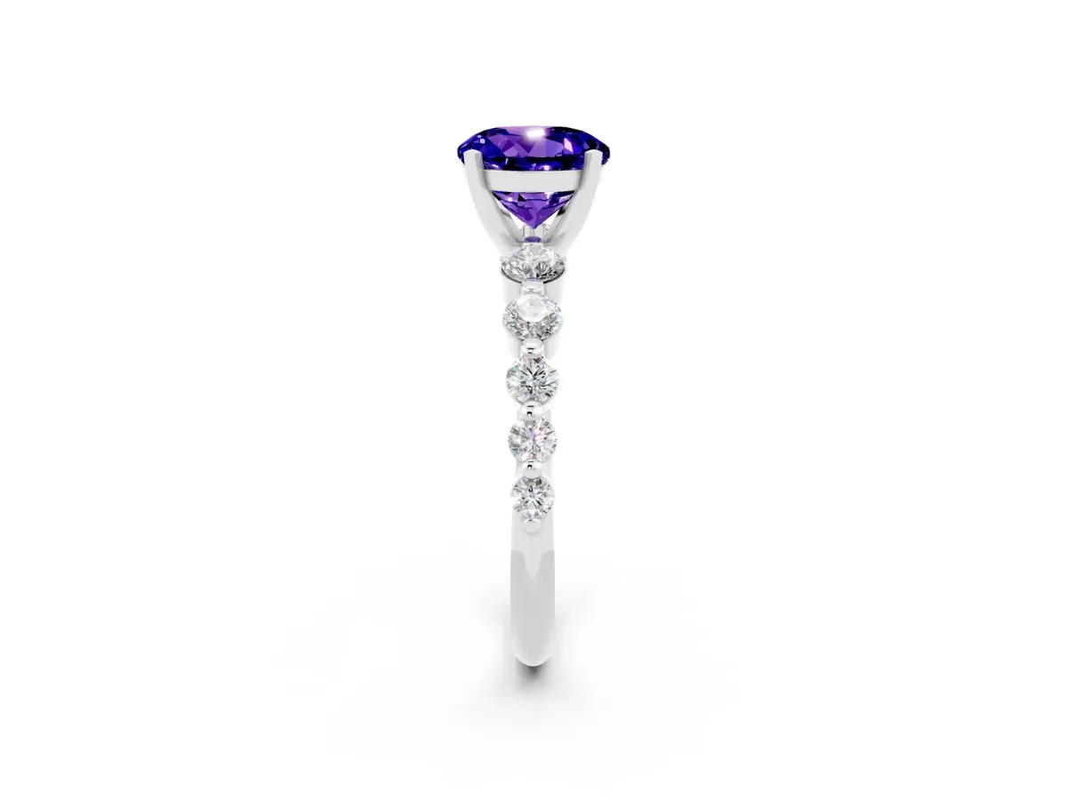 Round Cut Solitaire Tanzanite Ring with Pave Band and Four-Prong Setting Silver