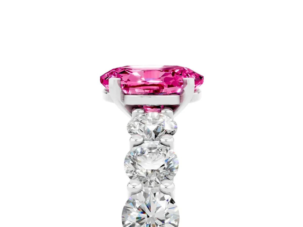 Oval Cut Pink Sapphire Prong Setting with Side Stones on a Pave Band Silver