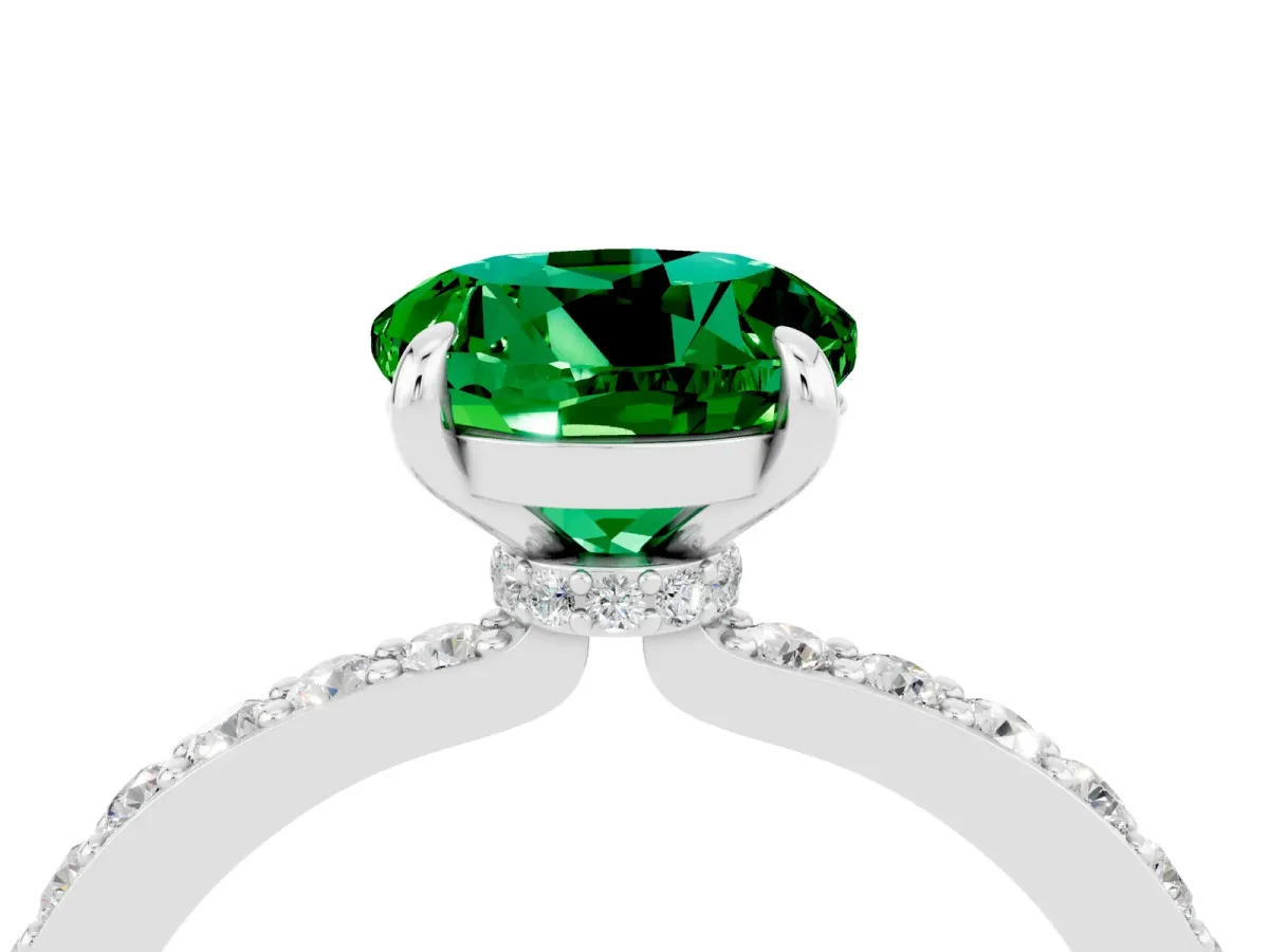 Round Cut Emerald Solitaire Engagement Ring with Pavé Band and Four-Prong Setting Silver