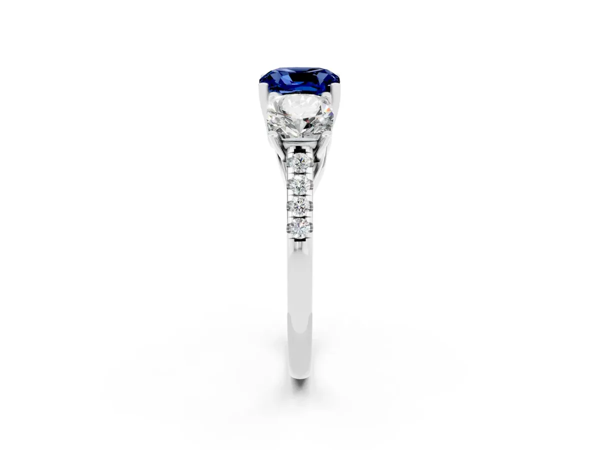 Three-Stone Cushion Cut Blue Sapphire Ring with Round Pavé Band and Prong Setting Silver