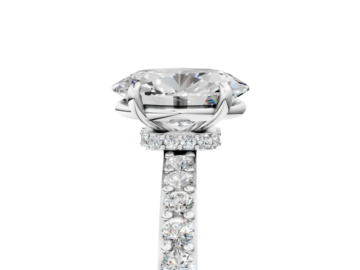 Oval Cut Diamond Solitaire Engagement Ring with Pavé Band and Four-Prong Setting Silver
