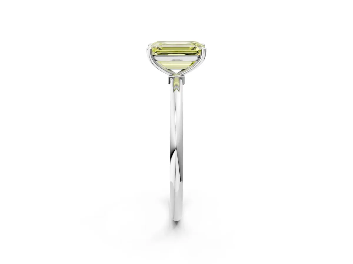 Fancy Yellow Emerald Cut Cut Solitaire Engagement Ring with Thin Band and Four-Prong Setting Silver