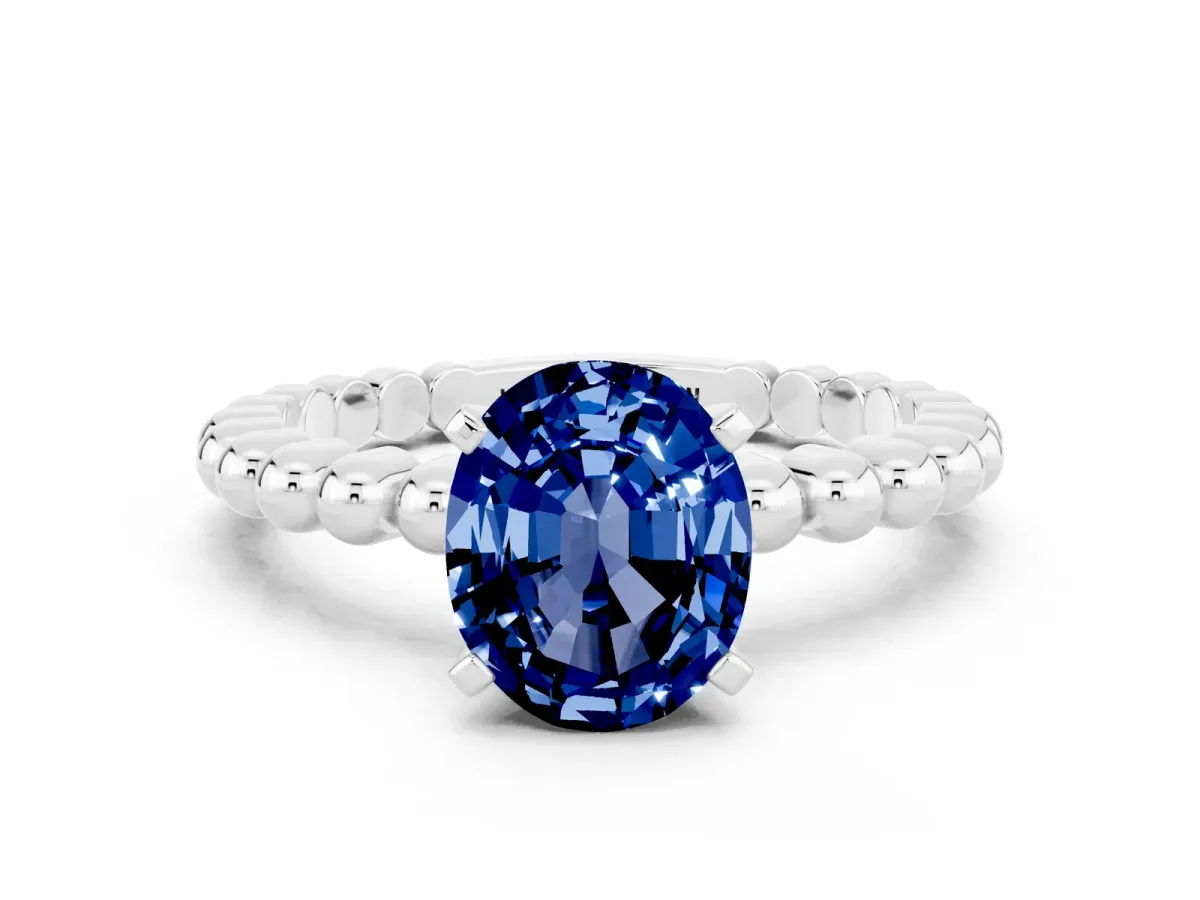 Oval Cut Blue Sapphire Solitaire Ring with Beaded Band and Prong Setting White gold