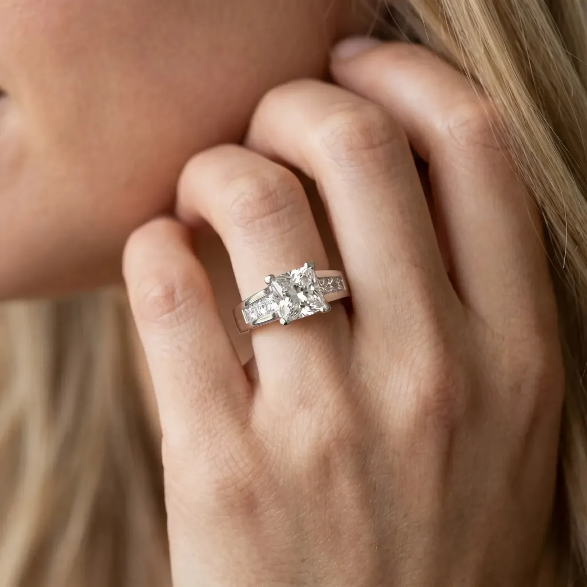Cushion Cut Cut Channel Set Solitaire Ring with Four-Prong Setting Platinum