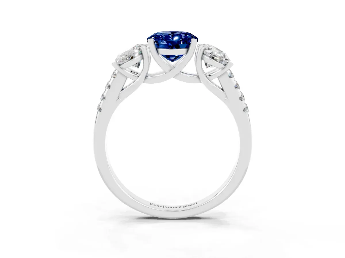 Three-Stone Oval Cut Blue Sapphire Ring with Round Pavé Band and Prong Setting Silver