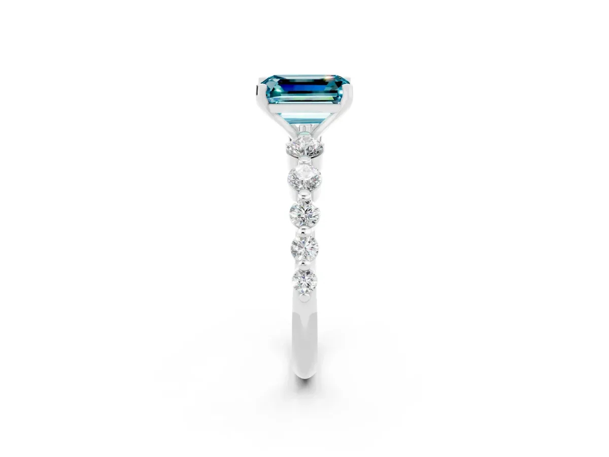 Emerald Cut Solitaire Blue Topaz Ring with Pave Band and Four-Prong Setting Platinum
