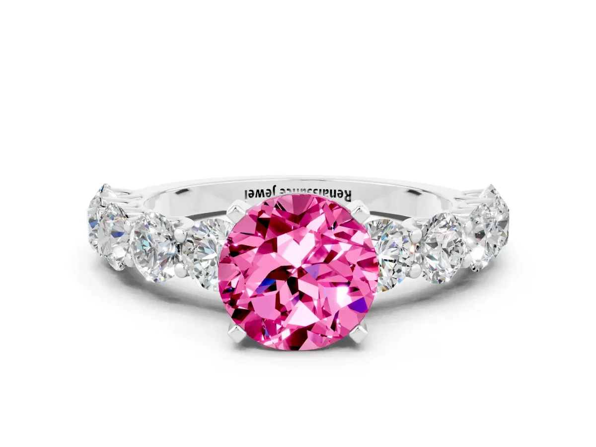 Round Cut Pink Sapphire Prong Setting with Side Stones on a Pave Band Silver