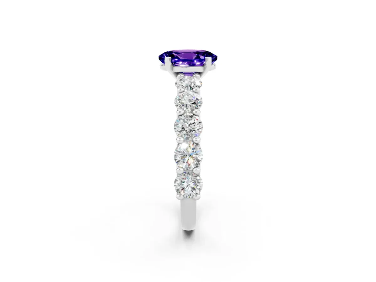 Oval Cut Tanzanite Prong Setting with Side Stones on a Pave Band Silver