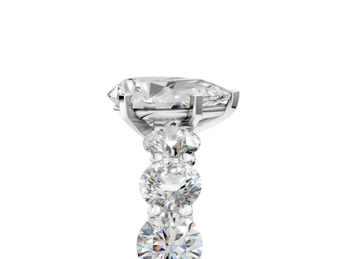 Pear Cut Diamond Prong Setting with Side Stones on a Pave Band Silver