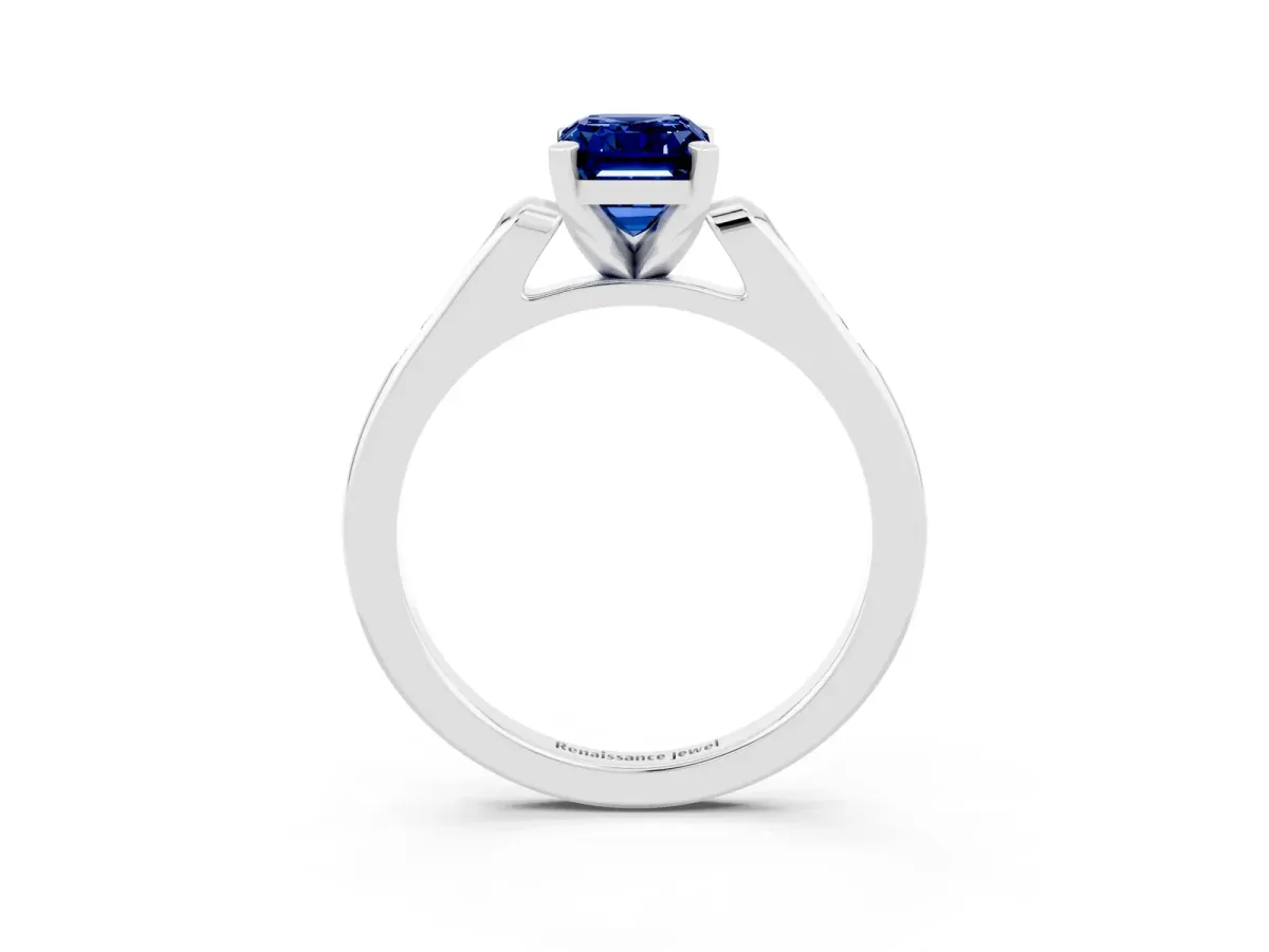 Emerald Cut Blue Sapphire Solitaire Ring with Channel Set Round Band and Prong Setting Silver