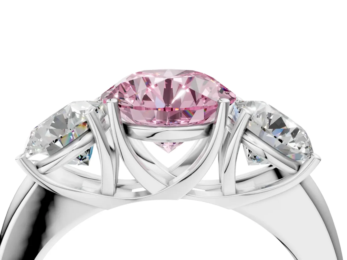 Fancy Pink Round Cut Diamond Three-Stone Ring with Four-Prong Setting and Classic Band Platinum