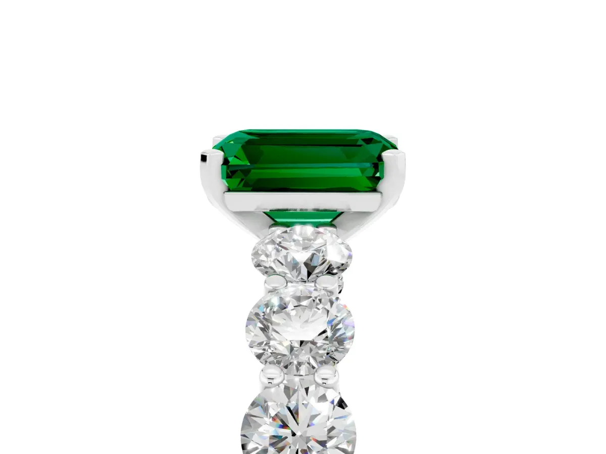 Emerald Cut Emerald Prong Setting with Side Stones on a Pave Band Platinum