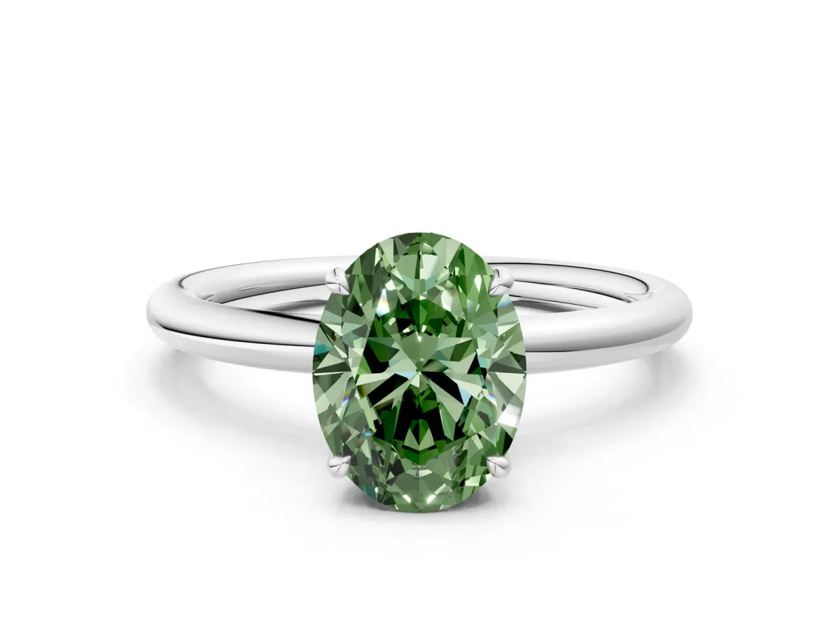 Fancy Green Oval Cut Diamond Solitaire Ring with Thin Band and Four-Prong Setting White gold