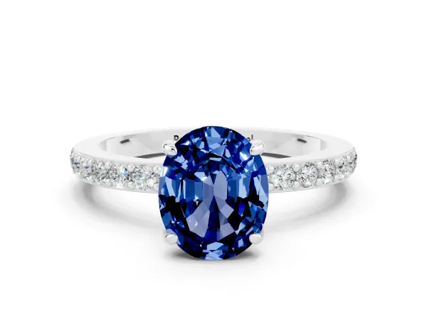 Oval Cut Blue Sapphire Solitaire Engagement Ring with Pavé Band and Four-Prong Setting Platinum