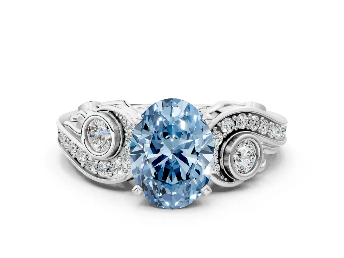 Fancy Blue Oval Cut Diamond Solitaire Ring with Milgrain Pavé Band and Four-Prong Setting Silver