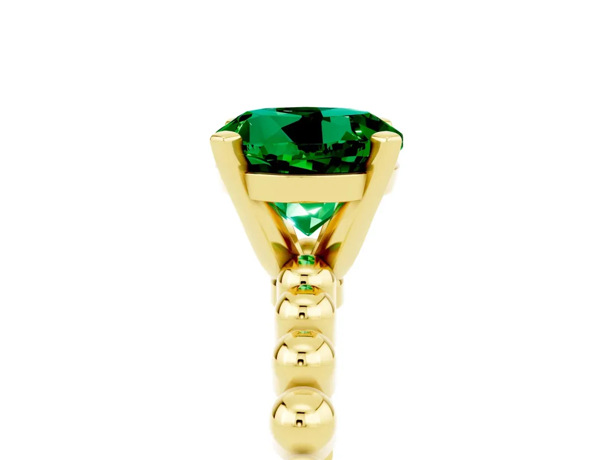 Round Cut Emerald Solitaire Ring with Beaded Band and Prong Setting Yellow gold