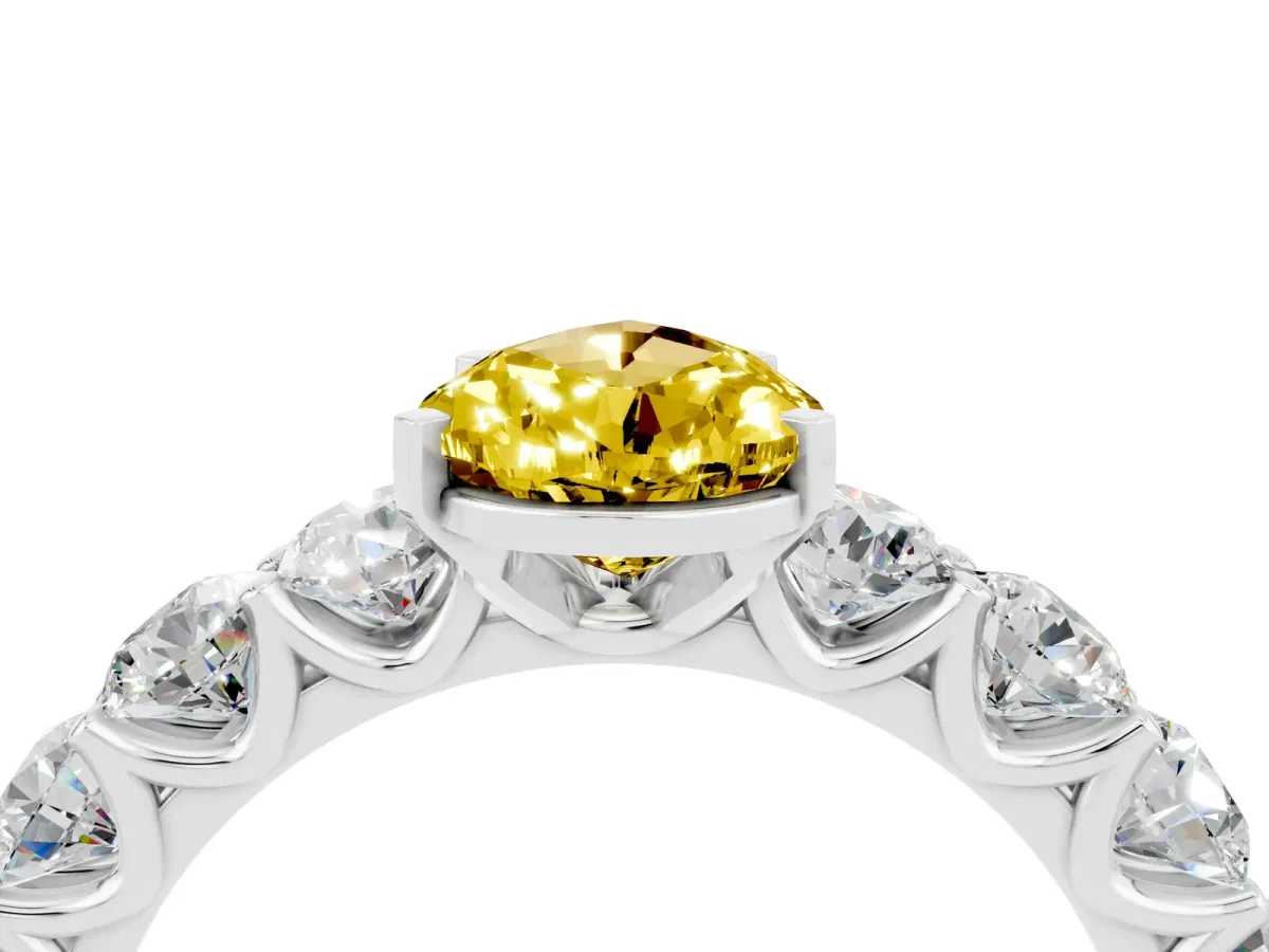 Pear Cut Yellow Sapphire Prong Setting with Side Stones on a Pave Band Silver