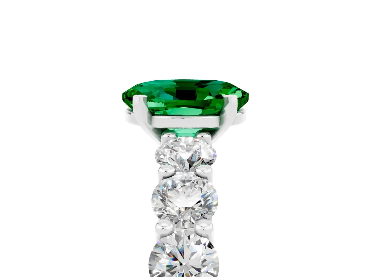 Oval Cut Emerald Prong Setting with Side Stones on a Pave Band Platinum