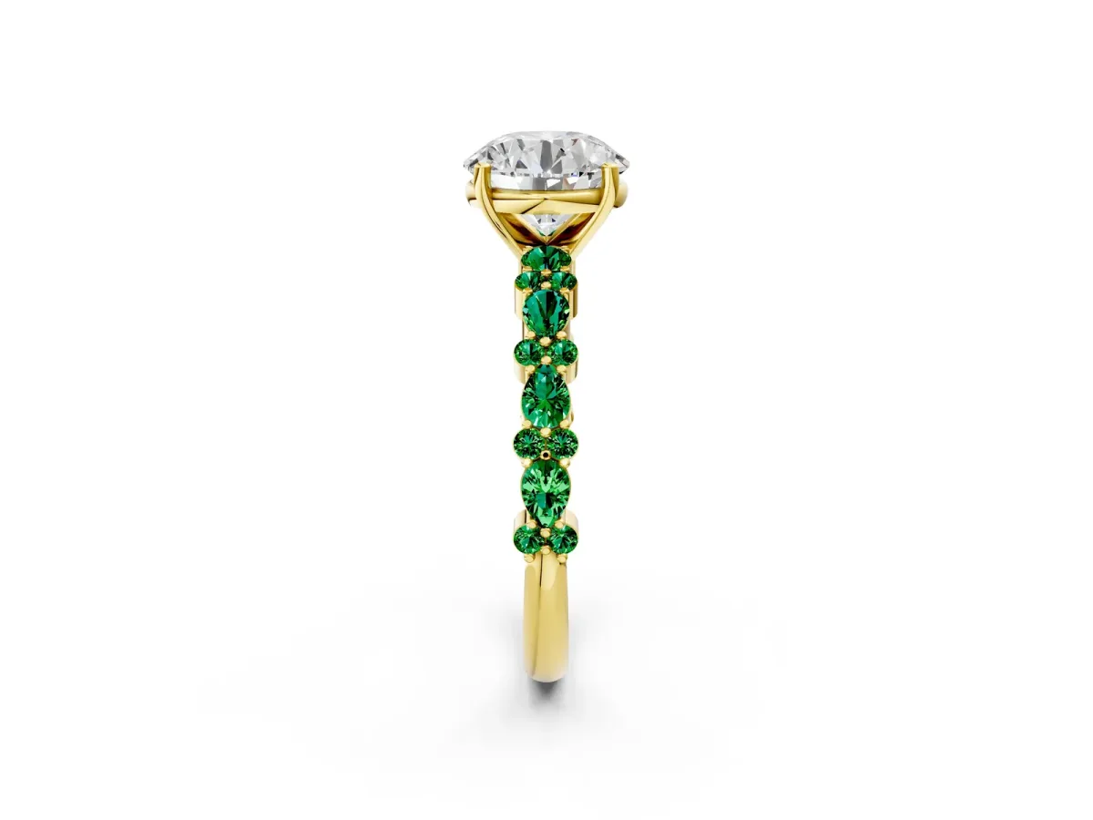 Round Cut Diamond Side Stone Solitaire Ring with Round Emerald and Four-Prong Setting Yellow gold