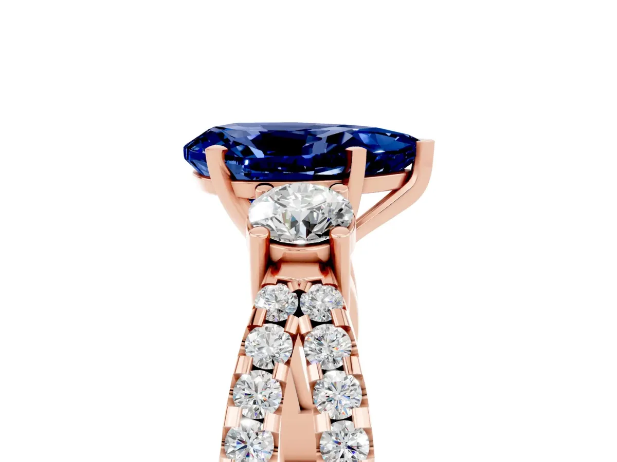 Pear Cut Blue Sapphire Three-Stone Ring with Pavé Split Shank and Four-Prong Setting Rose gold