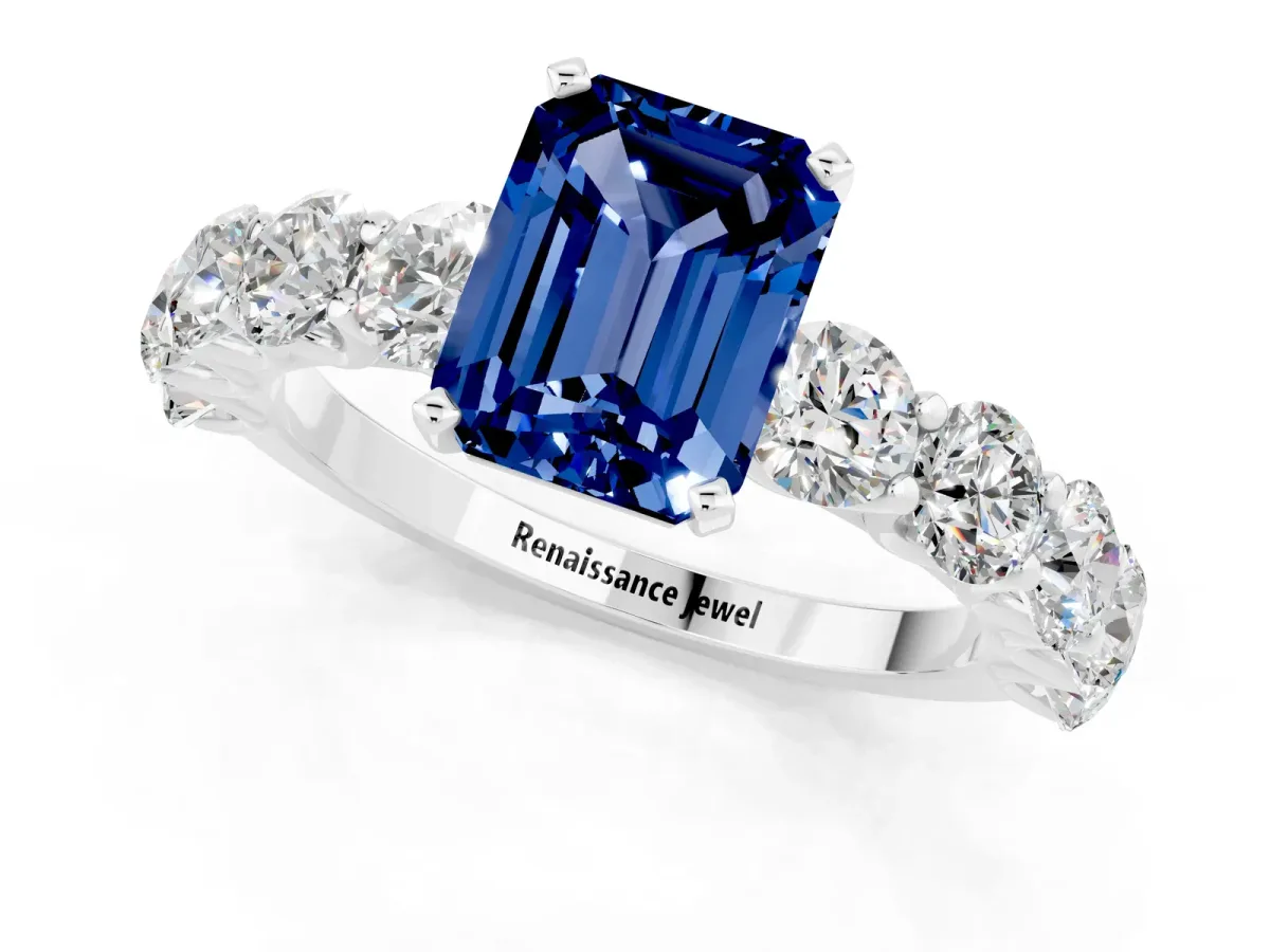 Emerald Cut Blue Sapphire Prong Setting with Side Stones on a Pave Band Silver