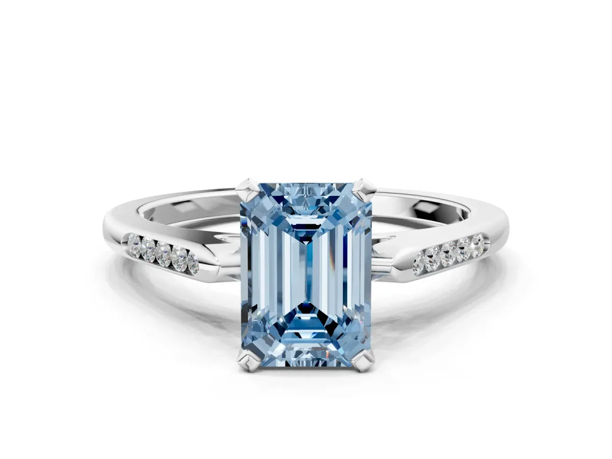 Fancy Blue Emerald Cut Diamond Solitaire Ring with Channel Set Round Band and Prong Setting Silver
