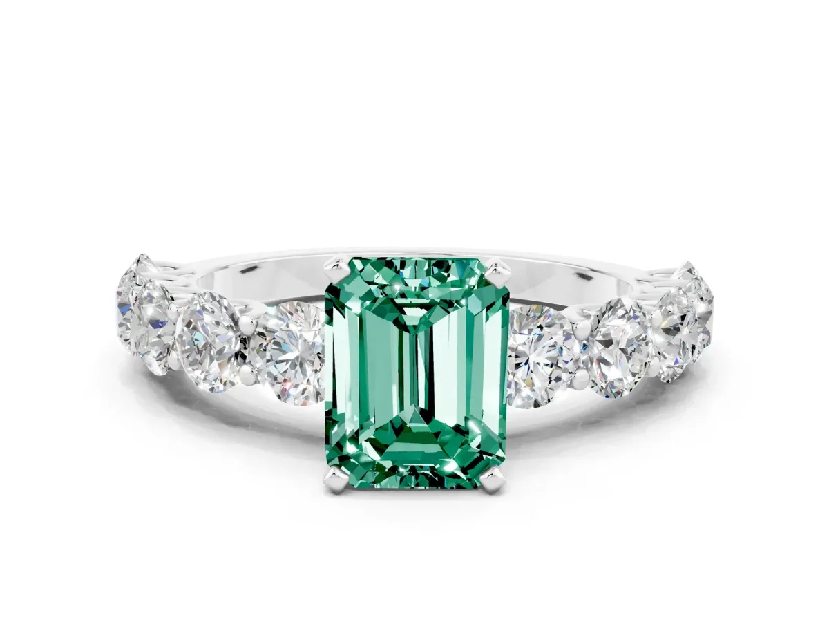 Emerald Cut Green Sapphire Prong Setting with Side Stones on a Pave Band Silver