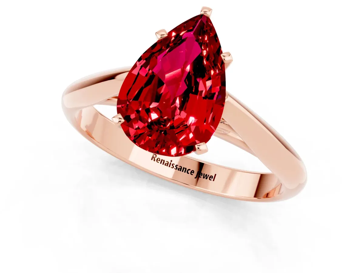 Pear Cut Ruby Solitaire Engagement Ring with Cathedral Setting and Four-Prong Mount Rose gold