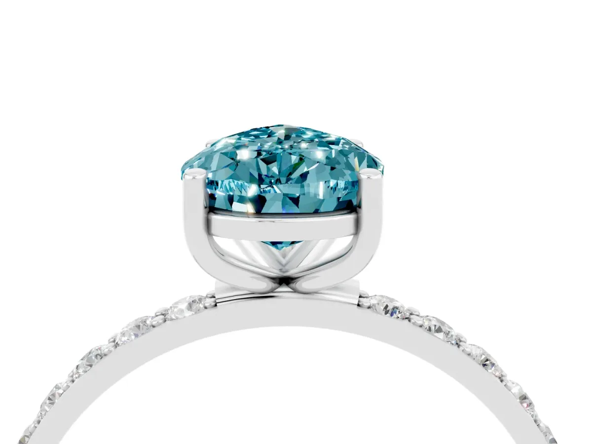 Pear Cut Blue Topaz Solitaire Ring with Round Pavé Band and Prong Setting Silver