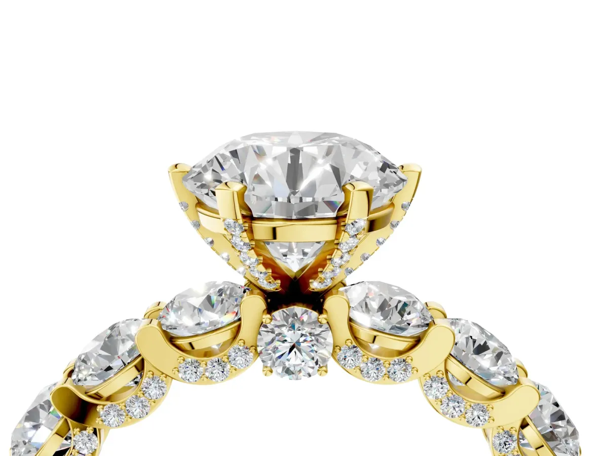 Round Cut Diamond Side Stone Engagement Ring with Four-Prong Setting Yellow gold
