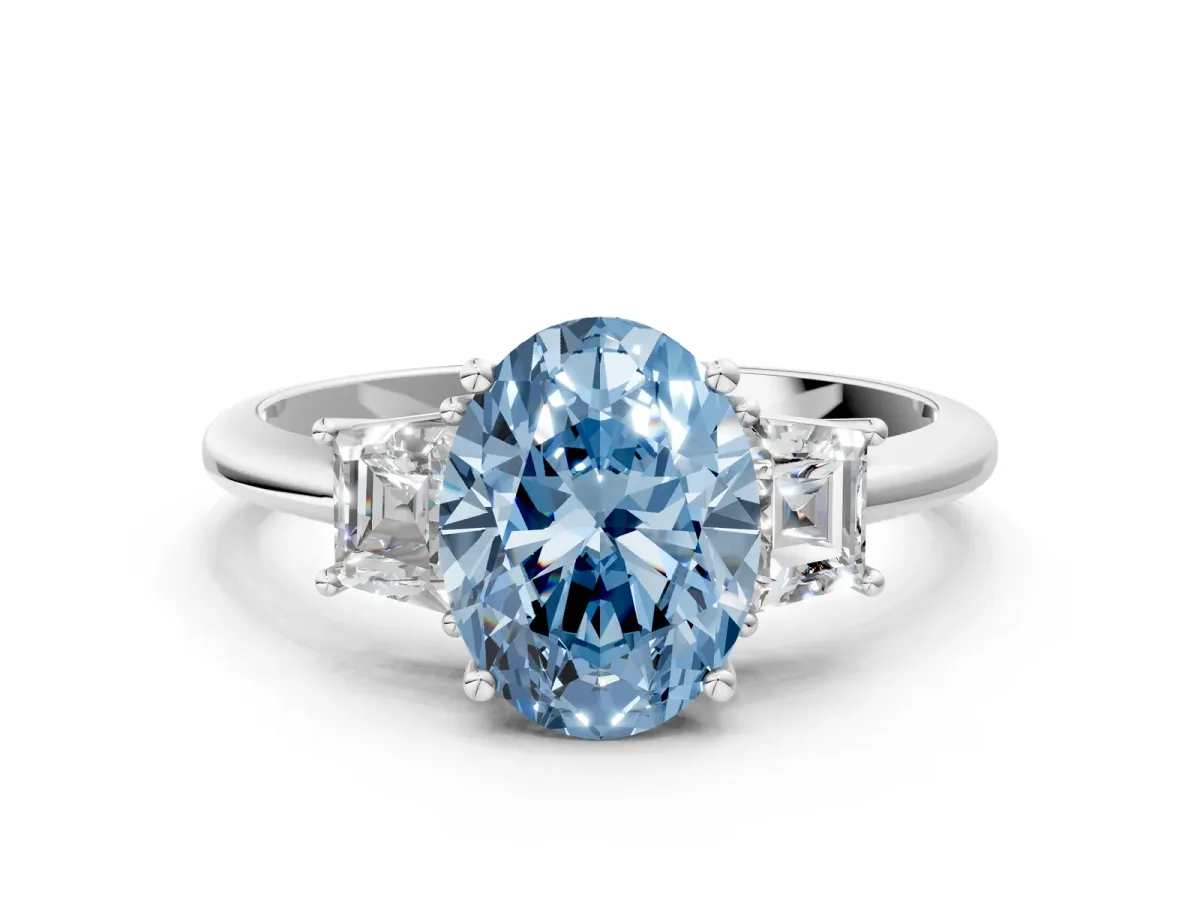 Fancy Blue Oval Cut Diamond Three-Stone Ring with Trapezoid Side Stones and Prong Setting Silver