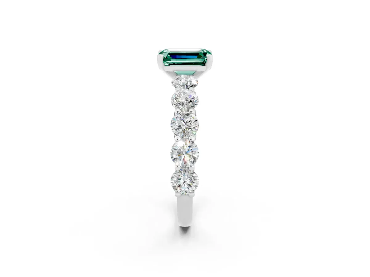 Emerald Cut Green Sapphire Prong Setting with Side Stones on a Pave Band Silver