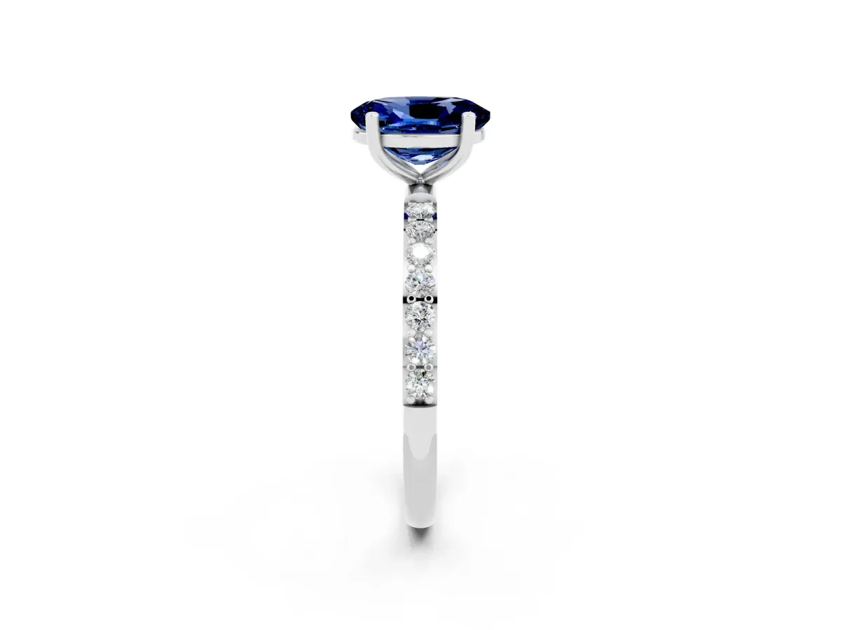 Oval Cut Blue Sapphire Solitaire Ring with Round Pavé Band and Prong Setting Silver
