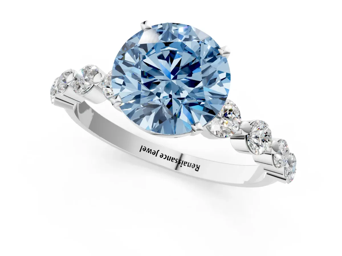 Fancy Blue Round Cut Solitaire Diamond Ring with Pave Band and Four-Prong Setting Silver