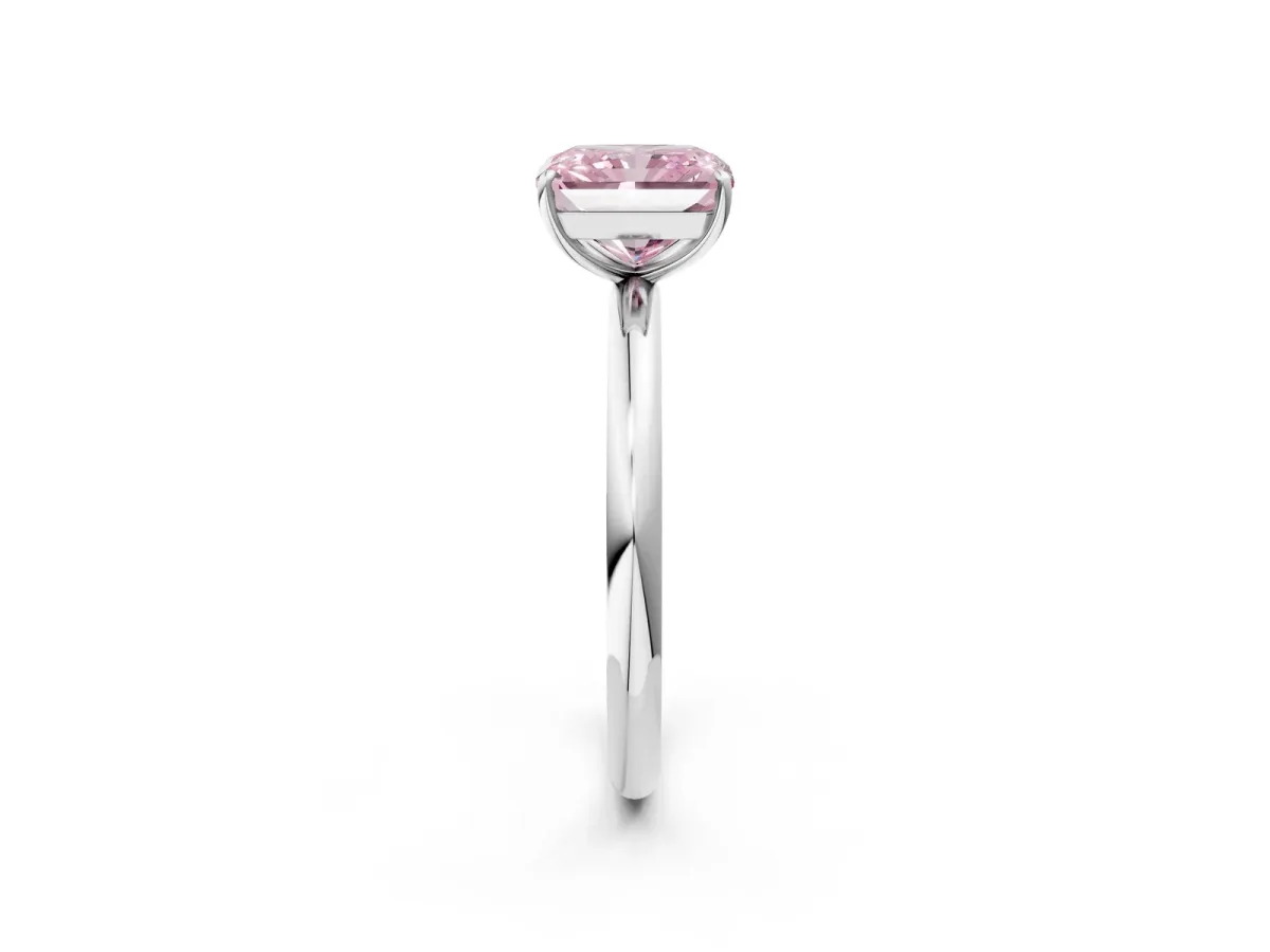 Fancy Pink Radiant Cut Solitaire Diamond Ring with Four-Prong Setting on a Plain Band Platinum