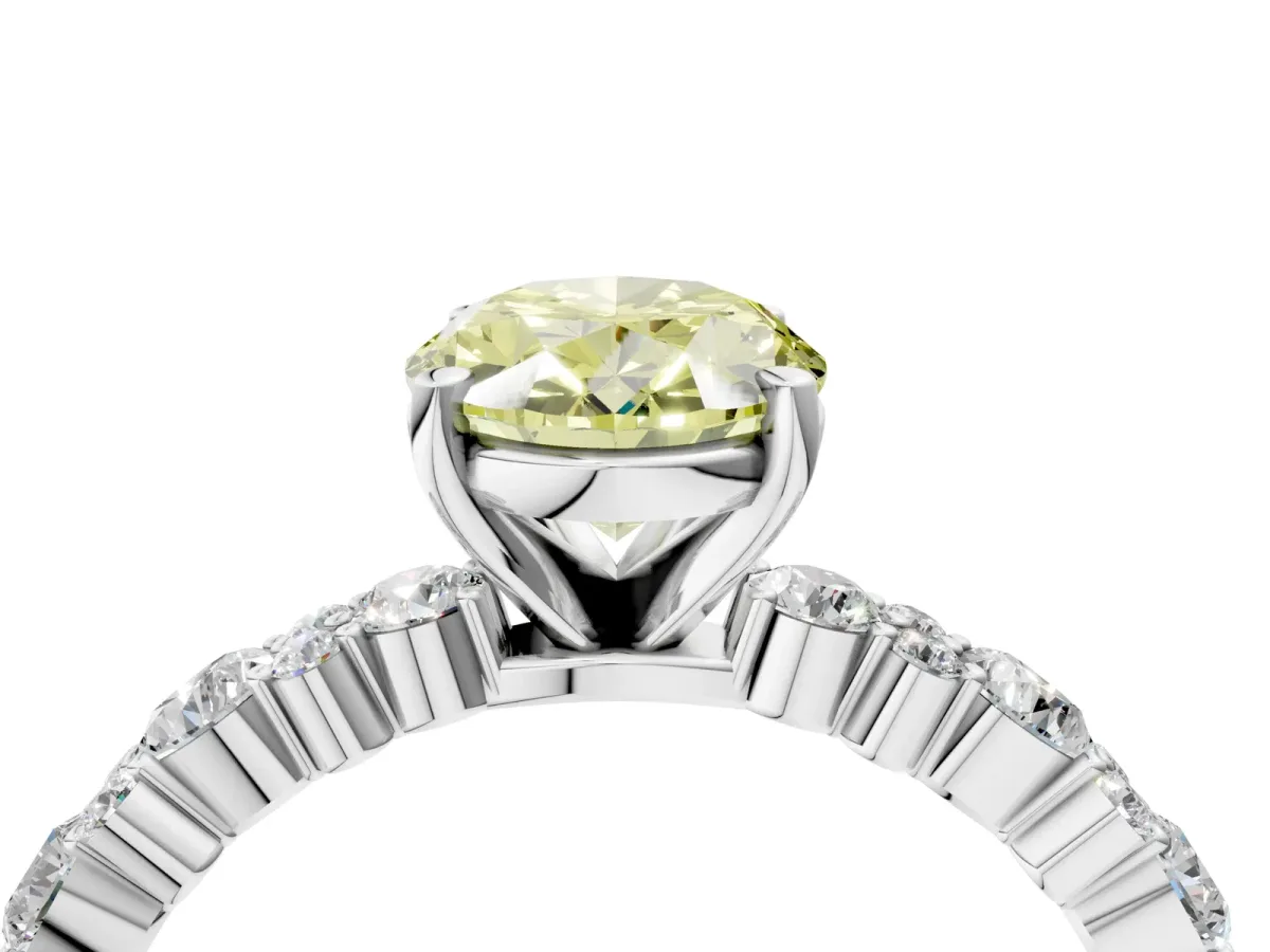 Fancy Yellow Oval Cut Diamond Side Stone Solitaire Ring with Round and Four-Prong Setting Platinum