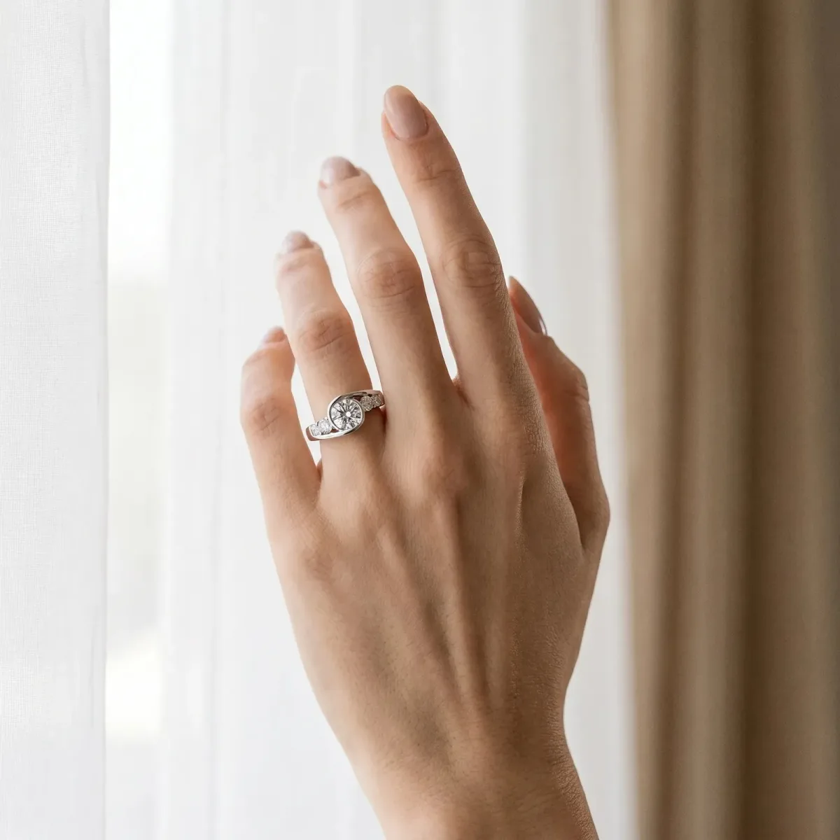 Bezel Set Cushion Cut Diamond Bypass Ring with Round Accents Platinum