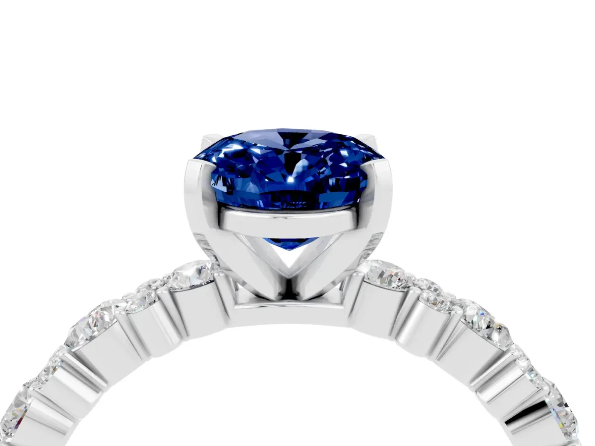 Oval Cut Blue Sapphire Side Stone Solitaire Ring with Round and Four-Prong Setting Platinum