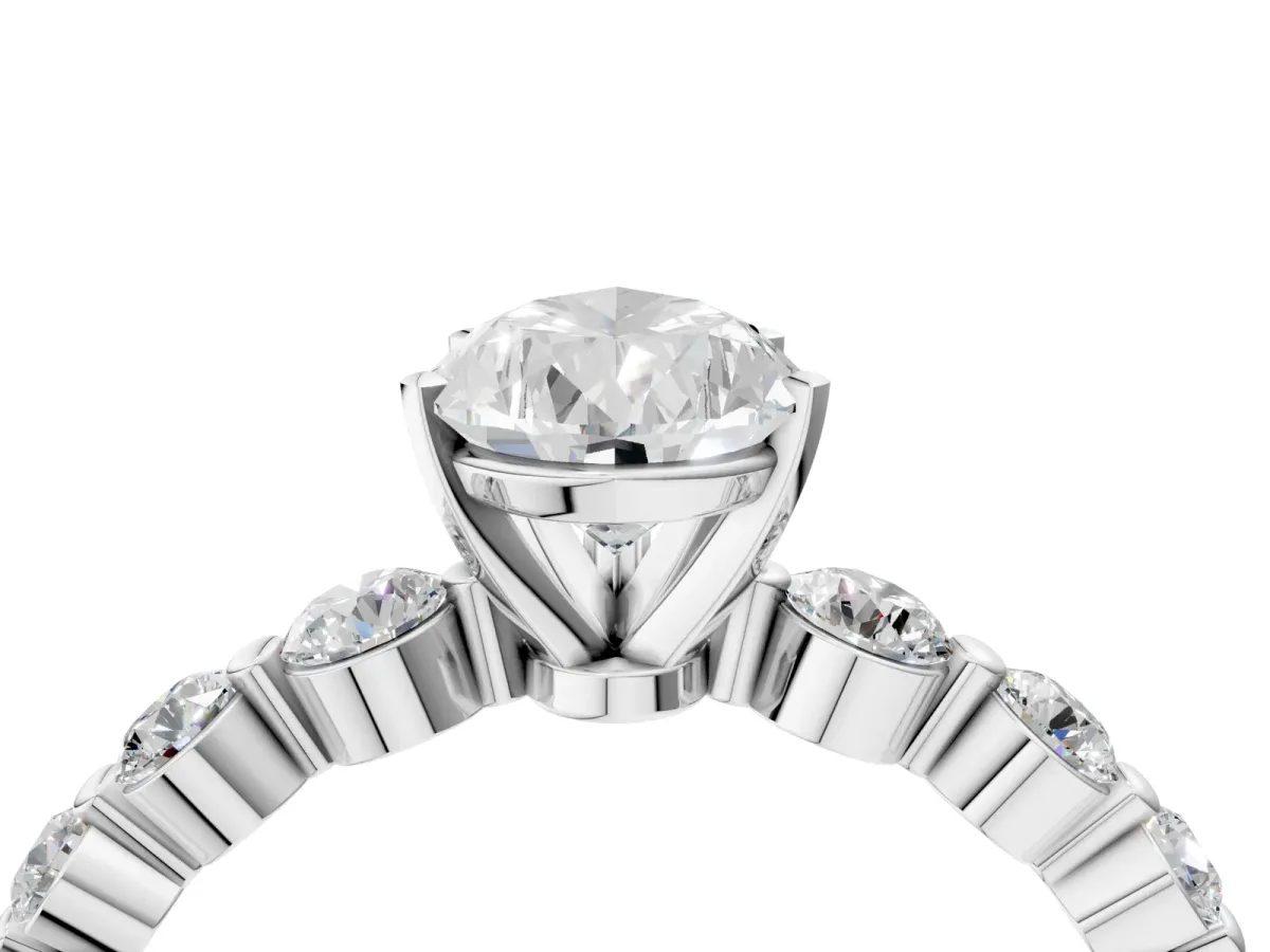 Pear Cut Solitaire Diamond Ring with Pave Band and Four-Prong Setting Silver