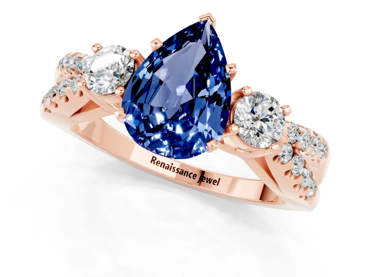 Pear Cut Blue Sapphire Three-Stone Ring with Pavé Split Shank and Four-Prong Setting Rose gold