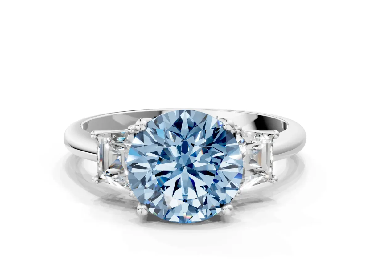 Fancy Blue Round Cut Diamond Three-Stone Ring with Trapezoid Side Stones and Prong Setting White gold