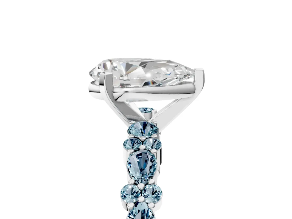 Pear Cut Diamond Side Stone Solitaire Ring with Round Aquamarine and Four-Prong Setting Silver