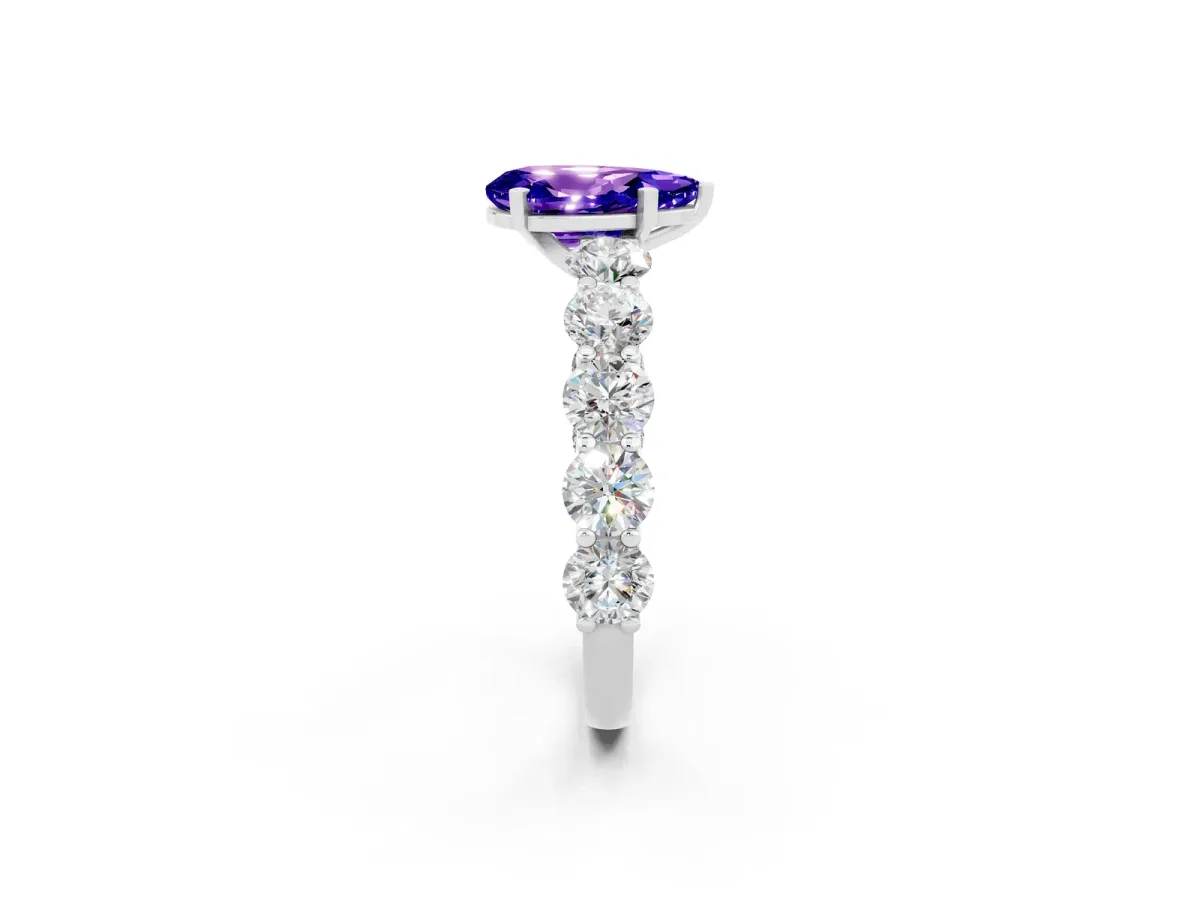 Pear Cut Tanzanite Prong Setting with Side Stones on a Pave Band Platinum