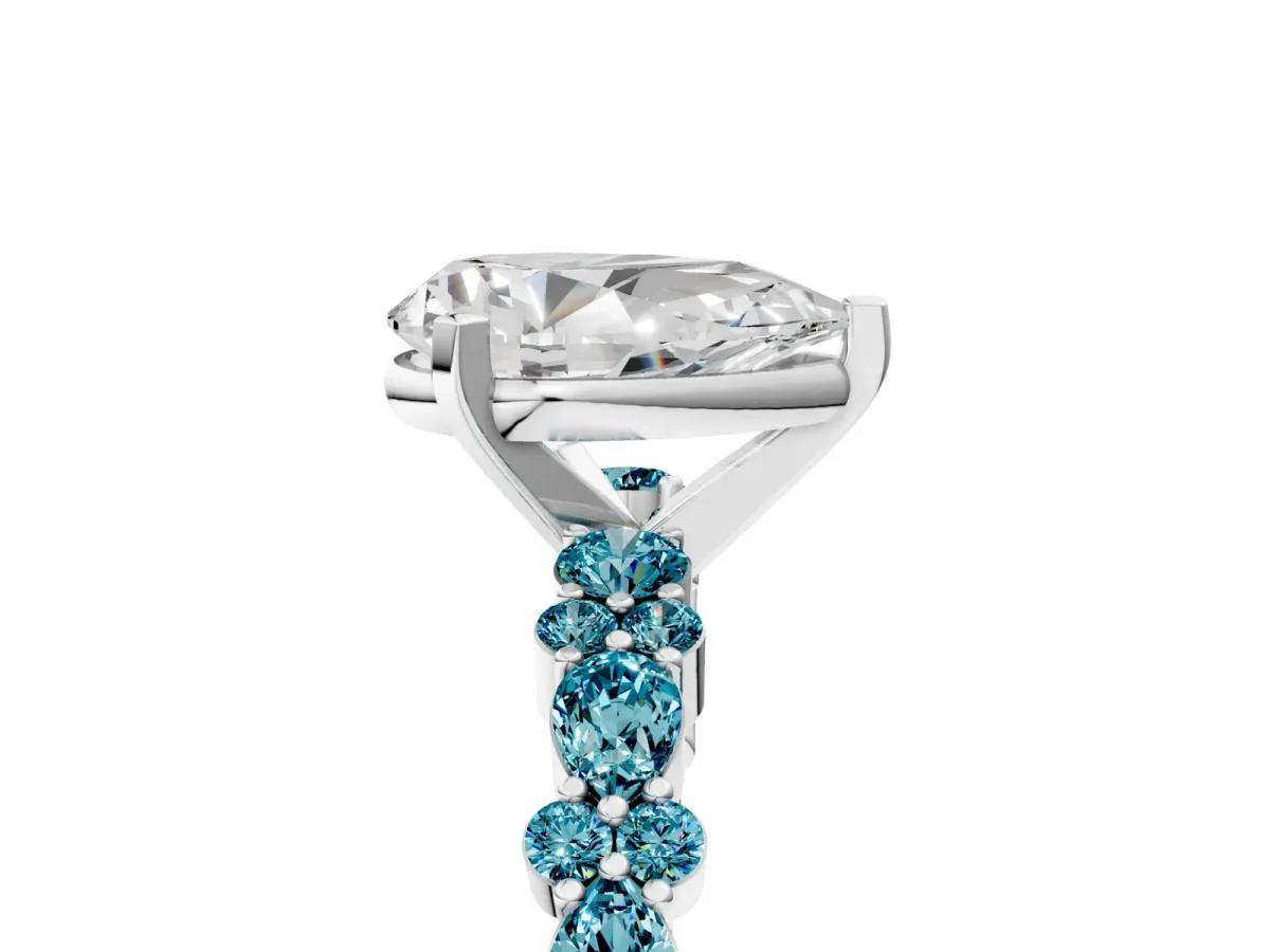Pear Cut Diamond Side Stone Solitaire Ring with Round Blue Topaz and Four-Prong Setting Platinum