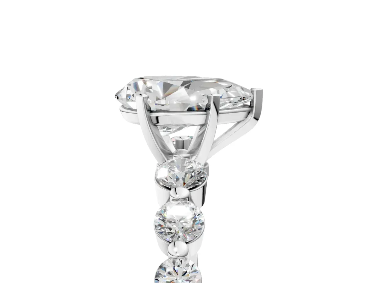 Pear Cut Solitaire Diamond Ring with Pave Band and Four-Prong Setting Platinum