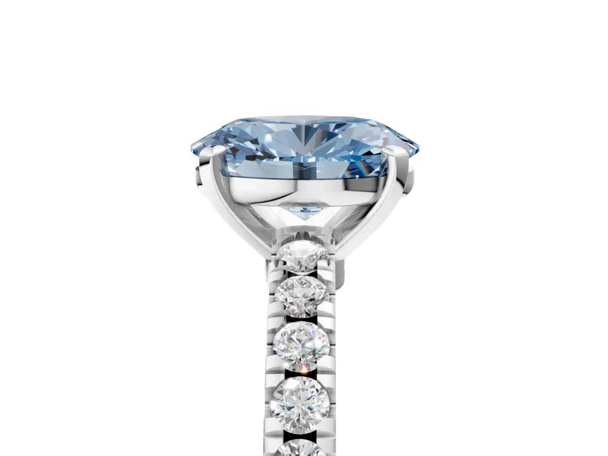 Fancy Blue Oval Cut Solitaire Diamond with Pavé Band and Four-Prong Setting Silver