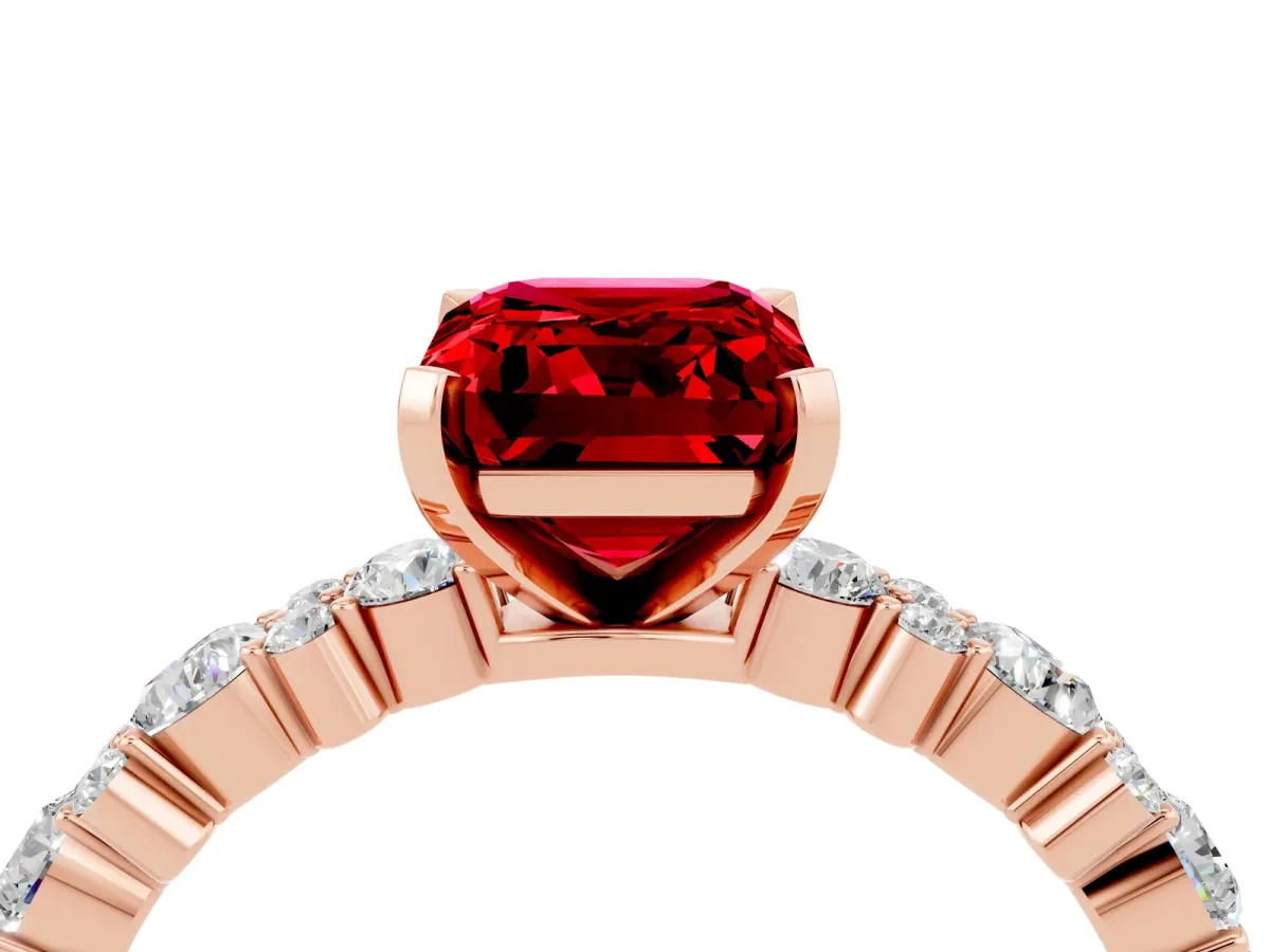 Emerald Cut Ruby Side Stone Solitaire Ring with Round and Four-Prong Setting Rose gold